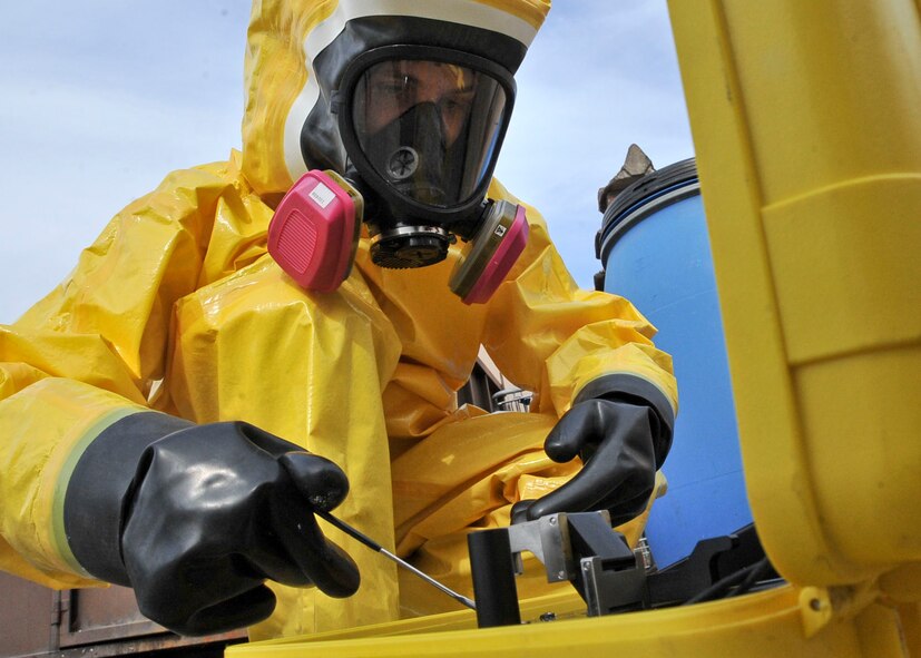 Staff Sgt. Christopher Adams, 51st Aerospace Medical Squadron bioenvironmental engineering non-commissioned officer in charge of emergency management operations, tests a suspicious substance sample during training Oct. 20, 2011. The substance is identified by the Hazmat Identifier by matching the chemical absorption that is unique to each chemical through infrared spectroscopy from its internal library database.  (U.S. Air Force photo/Senior Airman Adam Grant)     
