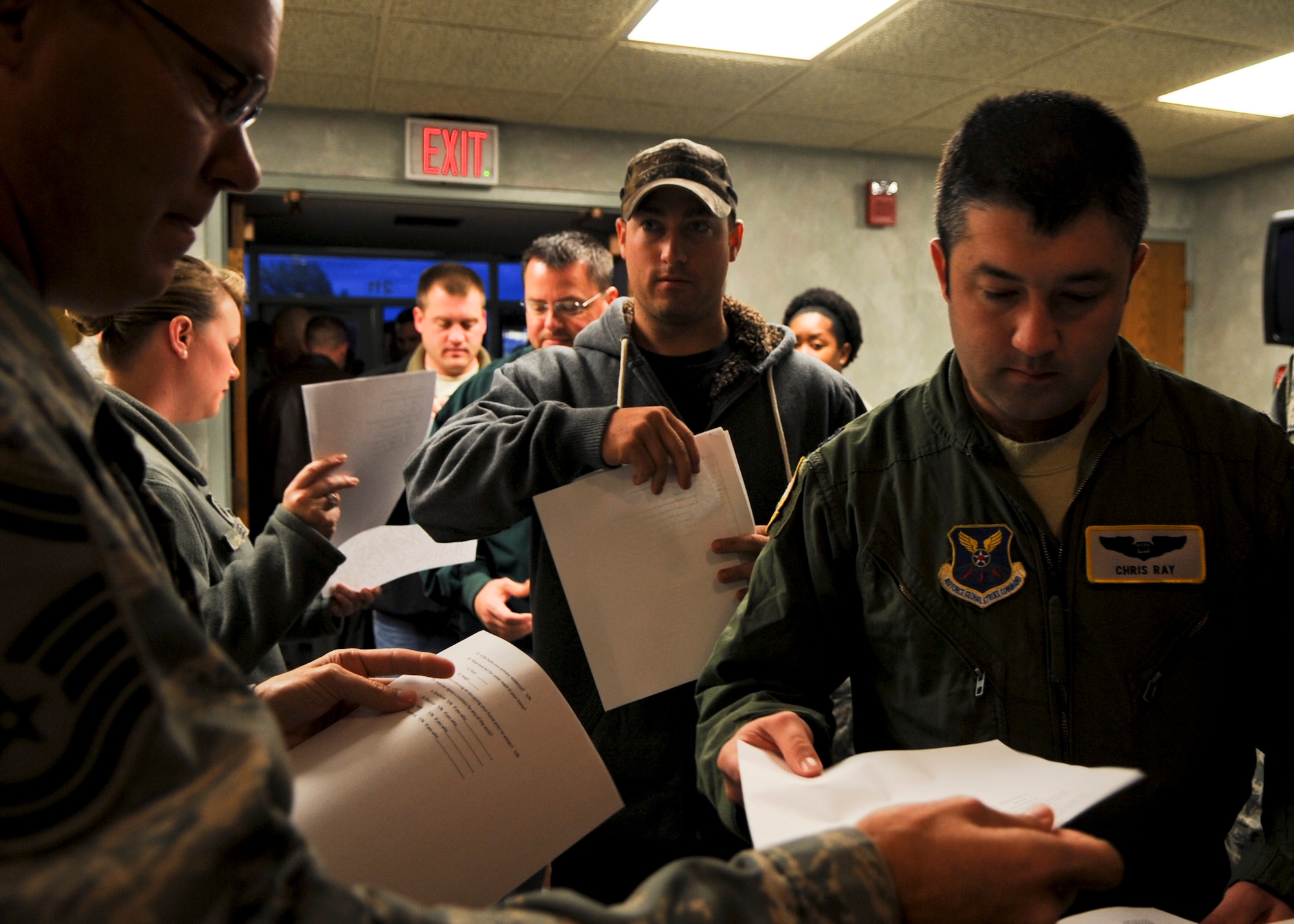 MINOT AIR FORCE BASE, N.D. - Airmen and their families affected by the historic 2011 Souris River flooding gathered at the base theater for a town hall meeting here, Oct. 23. Base leadership wanted to ensure critical information about seeking flood assistance and winterizing a home before the onset of winter was provided. (U.S. Air Force photo/Senior Airman Ashley N. Avecilla)