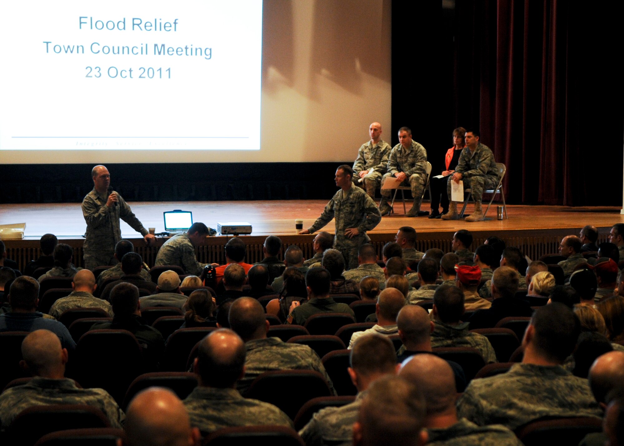 MINOT AIR FORCE BASE, N.D. - Airmen and their families affected by the historic 2011 Souris River flooding gathered at the base theater for a town hall meeting here, Oct. 23. Base leadership wanted to ensure critical information about seeking flood assistance and winterizing a home before the onset of winter was provided. (U.S. Air Force photo/Senior Airman Ashley N. Avecilla)