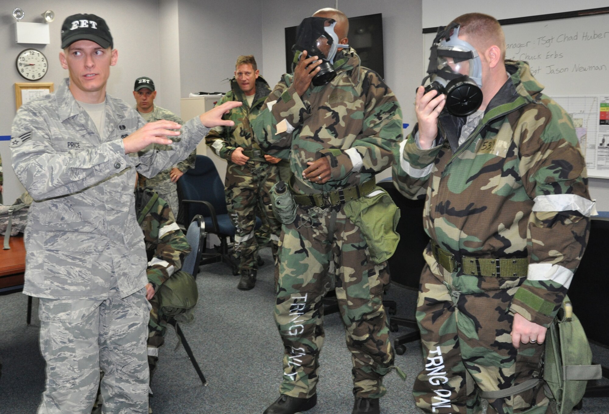 YOUNGSTOWN AIR RESERVE STATION, Ohio -- Air Force Reserve  Senior Airman David Price, an Emergency Management Apprentice with the 910th Civil Engineer Squadron, trains Reservists on how to properly don the MCU-2A/P protective mask.  The mask will soon be replaced by the M50 Joint Service General Purpose Mask which is lighter weight and more comfortable for the wearer. More than 300 Citizen Airmen participated in a base-wide attach exercise October 22-23 2011 to hone their skills in preparation for the 2013 Operation Readiness Inspection. U.S. Air Force photo by Maj. Brent J. Davis