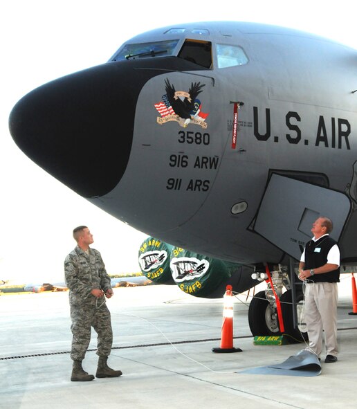 An Airman from the 916th Air Refueling Wing and David Perry from Carolina Mini Storage unveiled the winning noseart for the 25th anniversary on Thursday, Oct. 20 during the Business After Hours event at the 916th Corrosion Control Hangar. (USAF photo by SSgt. Mark Thompson, 916ARW/PA)