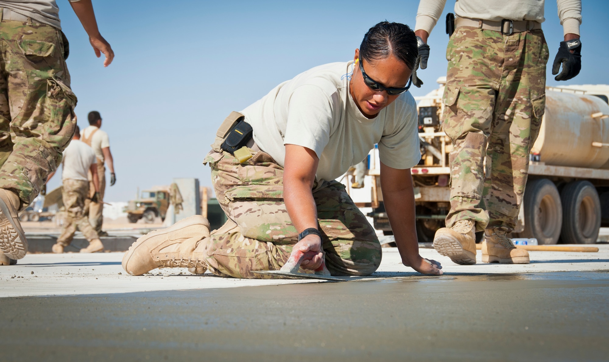 CAMP DWYER, Afghanistan -- Tech. Sgt. Kellen Buss, 809th Expeditionary RED HORSE Squadron Det. 1, edges the freshly set concrete at a new construction site at Camp Dwyer, Afghanistan, Oct. 18. Buss is deployed from the 820th RED HORSE Squadron at Nellis Air Force Base, Nev. (U.S. Air Force photo by Senior Airman David Carbajal)