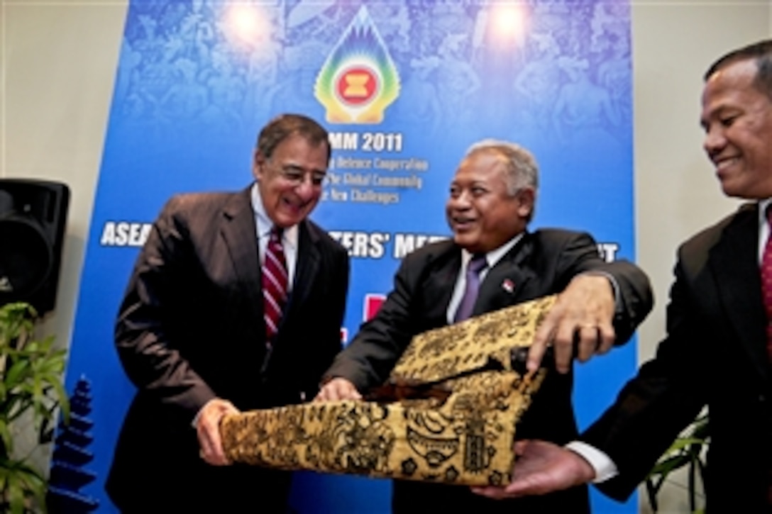 U.S. Defense Leon E. Panetta receives a customary Indonesian military sword from Indonesian Defense Minister Purnomo Yusgiantoro after a bilateral meeting in Bali, Indonesia, Oct. 23, 2011. The meeting reaffirmed U.S.-Indonesian defense relations and addressed mutual defense interests in the Asia-Pacific region.