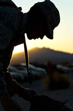 U.S. Air Force Airman 1st Class Andrew Timler, 509th Security Forces Squadron security forces apprentice from Whiteman Air Force Base, Mo., packs his rucksack for a training mission during the Ranger Assessment and Selection Course Oct. 21, 2011, at the Nevada Test and Training Range. Airmen must attend the RAS Course before going to the U.S. Army Ranger School, which is designed to train armed forces personnel to conduct combat operations within enemy lines. (U.S. Air Force photo by Airman 1st Class George Goslin/Released)