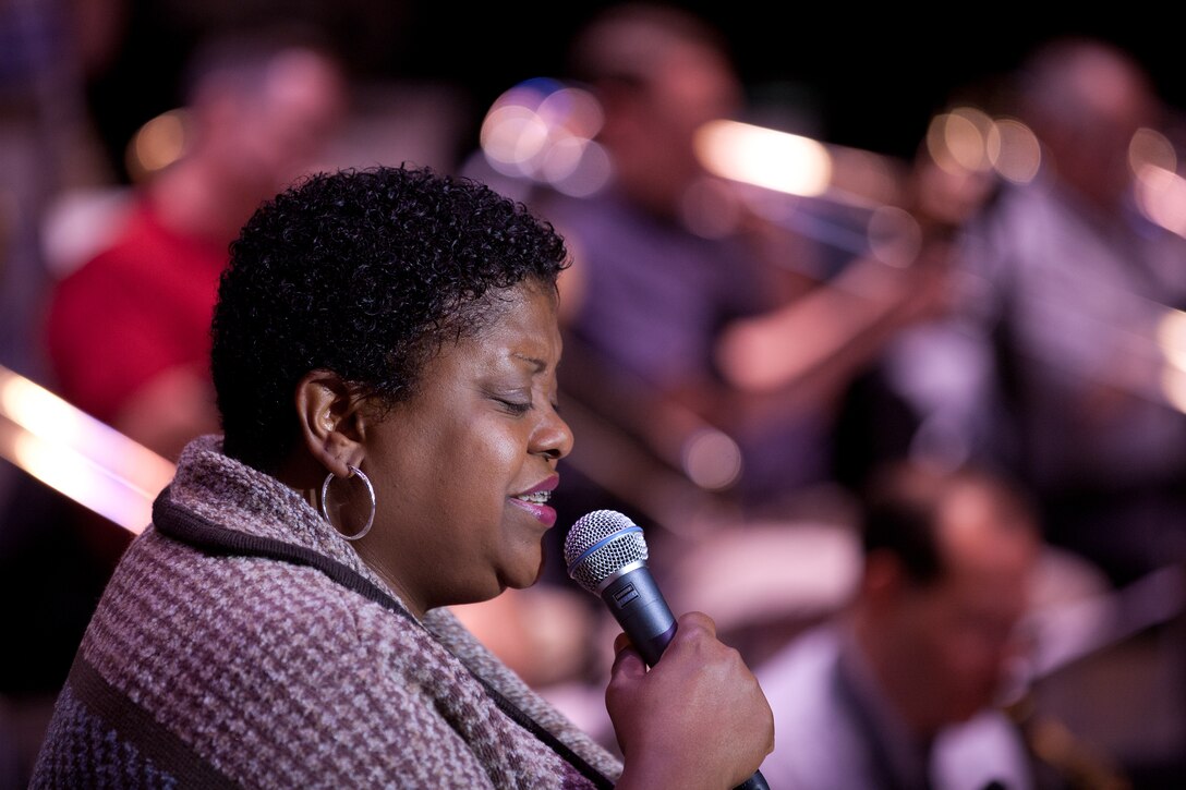 Carmen Bradford checks her microphone level during a soundcheck with the USAF Airmen of Note as the 2011 Jazz Heritage Series gets underway at Lisner Auditorium on the campus of The George Washington University in Washington, D.C. (photo courtesy of Rob Mesite Photography)