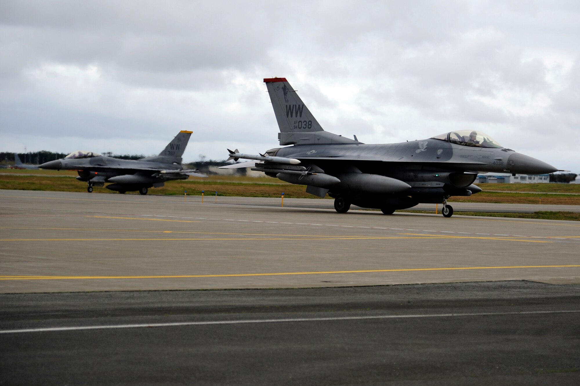 MISAWA AIR BASE, Japan - Members of the 13th Fighter Squadron taxi on Misawa's runway here Oct. 24. Several F-16 Fighting Falcons, with the 13 FS, returned home after an approximate one month long stay at Eielson Air Force Base, Alaska, in support of Operation Noble Eagle, Red Flag-Alaska and Distant Frontier exercise. (U.S. Air Force photo/Tech. Sgt. Marie Brown)