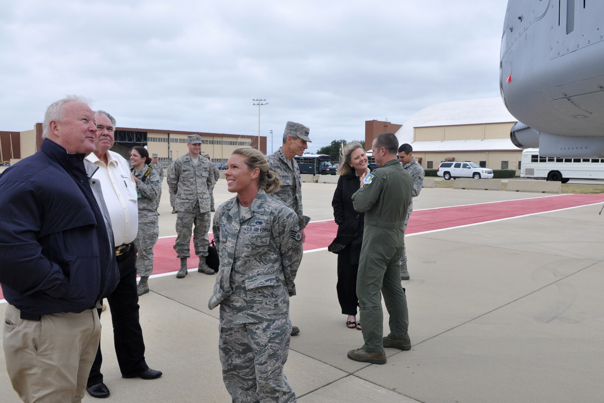 Lt. Col. James Travis, commander of the 47th Fighter Squadron, and Staff Sgt. Ricki Welch, a crew chief assigned to the 917th Aircraft Maintenance Squadron, brief civic leaders, as well as Air Force Chief of Staff Gen. Norton Schwartz and his wife Suzie, about the A-10 Thunderbolt II during their visit to Barksdale Air Force Base, La., Oct. 18, 2011. Fifteen civic leaders from across the country were taking part in an Air Force Chief of Staff Civic Leader Program trip, which visited Barksdale AFB Oct. 17-21, 2011. (U.S. Air Force photo/Master Sgt. Jeff Walston/Released)