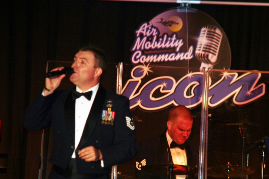 Tech. Sgt. Jamie Gilley, vocalist for the Starlifter band from the U.S. Air Force Band of Mid-America, sings during the 2011 Air Mobility Command Icon finals Oct. 20, 2011, at Scott Air Force Base, Ill. The Starlifter band played all of the music for the 10 competitors in the Icon competition. (U.S. Air Force Photo/Master Sgt. Scott T. Sturkol)