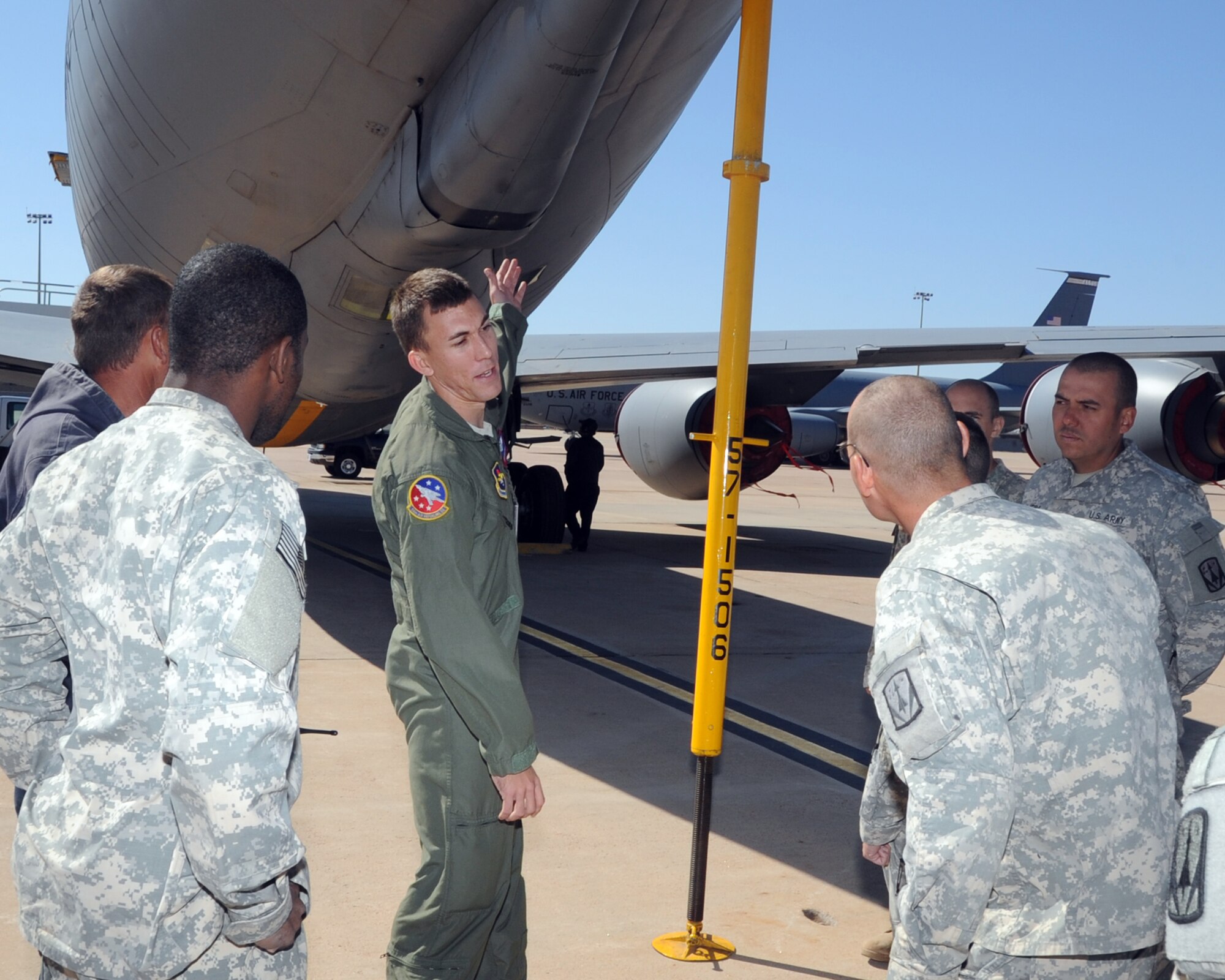 ALTUS AIR FORCE BASE, Okla. – Staff Sgt. Chris Joyce, 54th Air Refueling Squadron boom operator, explains to soldiers from the 4th Battalion 3rd Air Defense Artillery, Fort Sill, Okla., about how the boom on a KC-135 Stratotanker is used to refuel other aircraft, during a tour Oct. 20, 2011. The 4-3 ADA BN brought about 250 soldiers to Altus AFB completing a 10-day training event that tested communications between multiple Patriot missile battery sites and evaluated how the unit would handle scenarios that could be encountered in a deployed environment. (U.S. Air Force photo by Airman 1st Class Kenneth W. Norman / Released / 97th Air Mobility Wing Public Affairs)