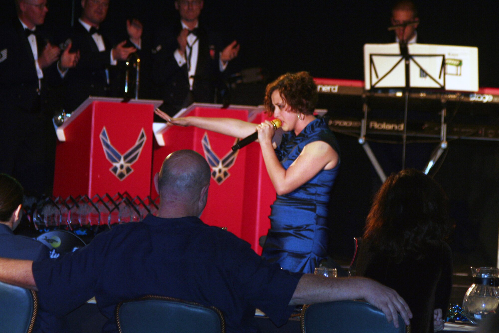 Senior Airman Naomi Scott sings "Rolling in Deep" during the Air Mobility Command Icon finals competition Oct. 20, 2011, at Scott Air Force Base, Ill. Scott made it to the finals by winning the base level competition at Dover AFB, Del., and she took first place in the event. Icon is an AMC commander's initiative to showcase the vocal talents of AMC Airmen. Each AMC base holds Icon contests in July and August to determine their representatives for the command final which takes place at Scott AFB. (U.S. Air Force Photo/Master Sgt. Scott T. Sturkol)