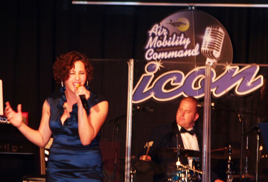 Senior Airman Naomi Scott sings "Rolling in Deep" during the Air Mobility Command Icon finals competition Oct. 20, 2011, at Scott Air Force Base, Ill. Scott made it to the finals by winning the base level competition at Dover AFB, Del., and she took first place in the event. Icon is an AMC commander's initiative to showcase the vocal talents of AMC Airmen. Each AMC base holds Icon contests in July and August to determine their representatives for the command final which takes place at Scott AFB. (U.S. Air Force Photo/Master Sgt. Scott T. Sturkol)