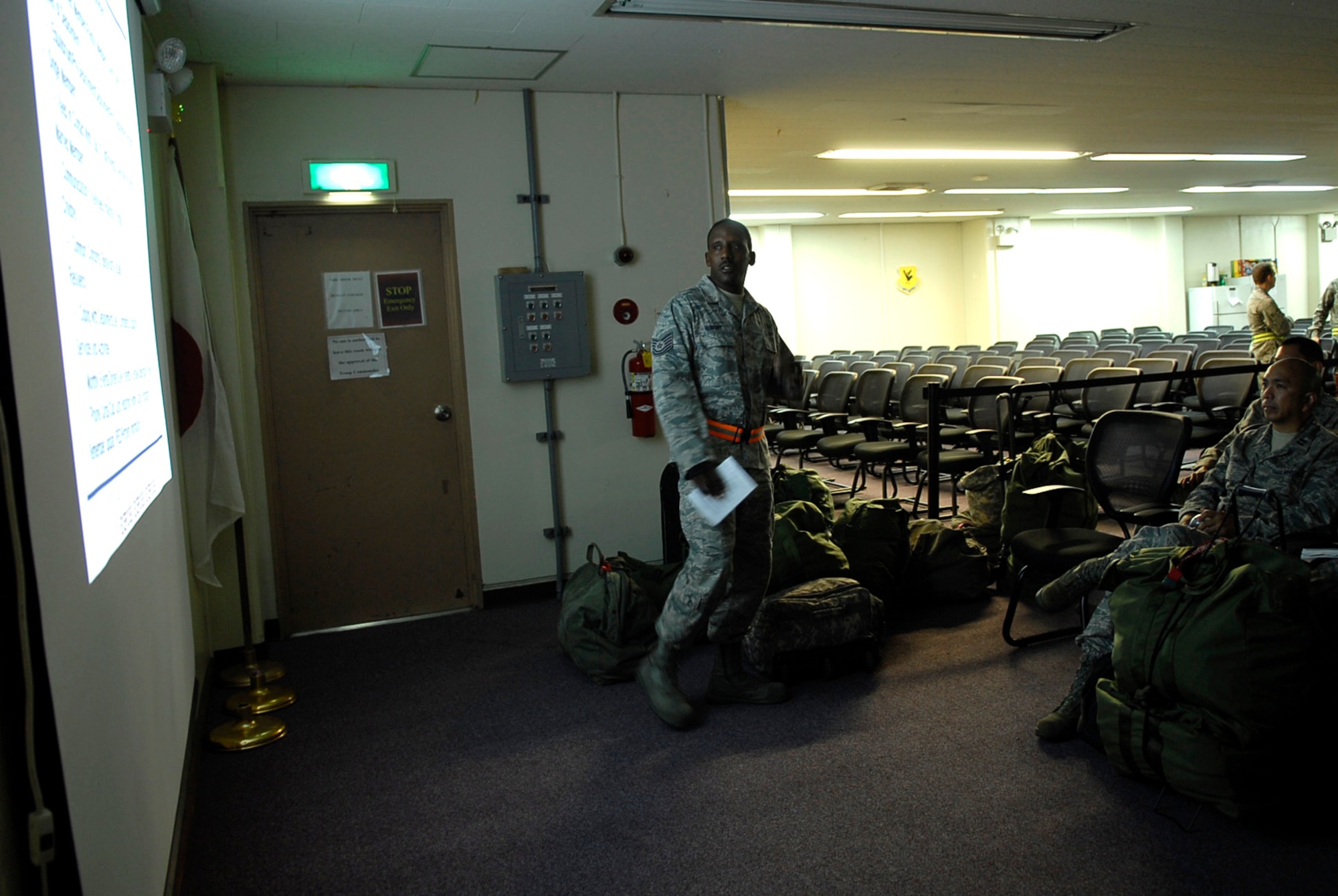 Tech Sgt. Devin Wright, 18th Force Support Squadron Airman and Family Readiness Center readiness office, gives a pre-deployment briefing to a group of simulated deployers during local operational readiness exercise Beverly High 12-1 at Kadena Air Base, Japan, Oct. 25. The A&FRC offers many different tools to help service members and their families, even while deployed. (U.S. Air Force photo/ Airman 1st Class Tara A. Williamson/ released)