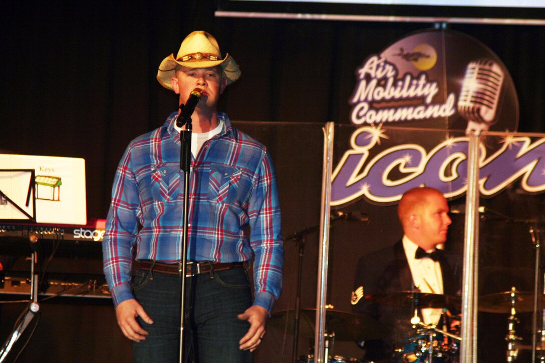 Senior Airman John Maness sings "Muddy Water" during the Air Mobility Command Icon finals competition Oct. 20, 2011, at Scott Air Force Base, Ill. Maness made it to the finals by winning the base level competition at Grand Forks AFB, N.D. Icon is an AMC commander's initiative to showcase the vocal talents of AMC Airmen. Each AMC base holds Icon contests in July and August to determine their representatives for the command final which takes place at Scott AFB. (U.S. Air Force Photo/Master Sgt. Scott T. Sturkol)