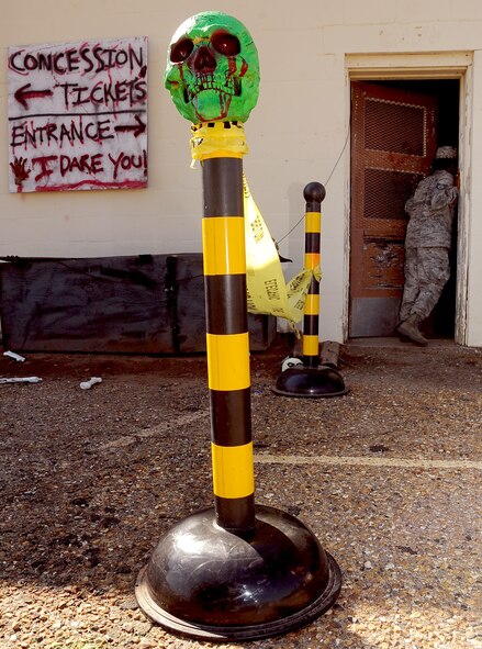 Staff Sgt. Chonte' Walker, 2nd Civil Engineer Squadron emergency management flight, checks inside the 2 CES haunted house to make sure the light effects are working properly on Barksdale Air Force Base, La., Oct. 24. The haunted house, which runs from Oct. 24 to Oct. 31, is an attraction that Airmen from the 2 CES prepare the entire month of Oct. for Team Barksdale. (U.S. Air Force photo/Senior Airman Amber Ashcraft)(RELEASED)