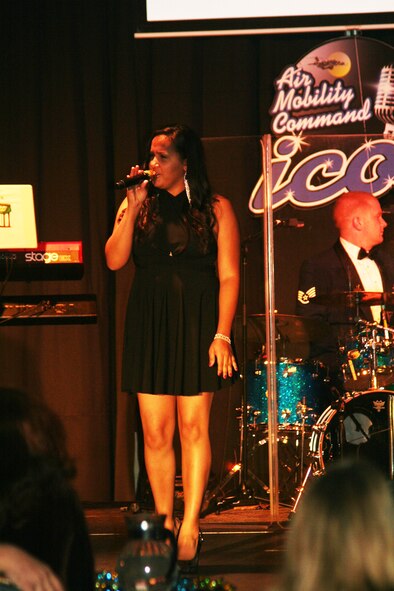 Staff Sgt. Kecia Harris sings "Broken-hearted Girl" during the Air Mobility Command Icon finals competition Oct. 20, 2011, at Scott Air Force Base, Ill. Harris made it to the finals by winning the base level competition at Travis AFB, Calif. Icon is an AMC commander's initiative to showcase the vocal talents of AMC Airmen. Each AMC base holds Icon contests in July and August to determine their representatives for the command final which takes place at Scott AFB. (U.S. Air Force Photo/Master Sgt. Scott T. Sturkol)