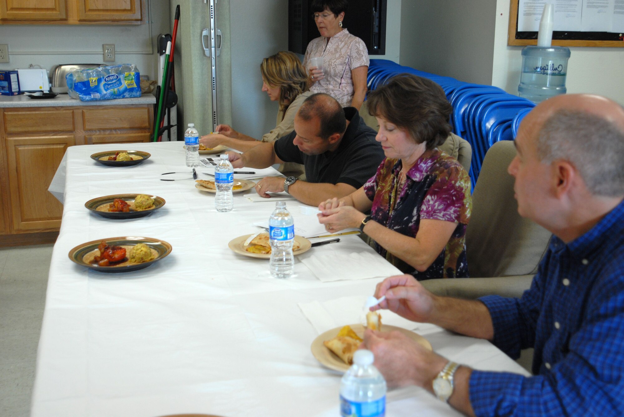 GOODFELLOW AIR FORCE BASE, Texas-- Col. Mark Damiano, 17th Training Wing Commander, his wife Ellery, Chaplain (Lt. Col.) Bruce Glover and his wife, Carol judge the dishes team Tu Madre present in the final round of Goodfellow’s version of the Iron Chef competition at Crossroads here Oct. 22. The two teams, both comprised of 315th Training Squadron students had one hour to create three dishes spotlighting the secret ingredient: plantains. The winner, Team 341, received gift certificates to a local restaurant. (U.S. Air Force photo/Airman 1st Class Jessica Keith)