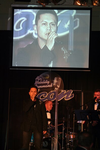 Staff Sgt. Mel Penaflorida sings "Unchained Melody" during the Air Mobility Command Icon finals competition Oct. 20, 2011, at Scott Air Force Base, Ill. Penaflorida made it to the finals by winning the base level competition at Joint Base Charleston, S.C. Icon is an AMC commander's initiative to showcase the vocal talents of AMC Airmen. Each AMC base holds Icon contests in July and August to determine their representatives for the command final which takes place at Scott AFB. (U.S. Air Force Photo/Master Sgt. Scott T. Sturkol)