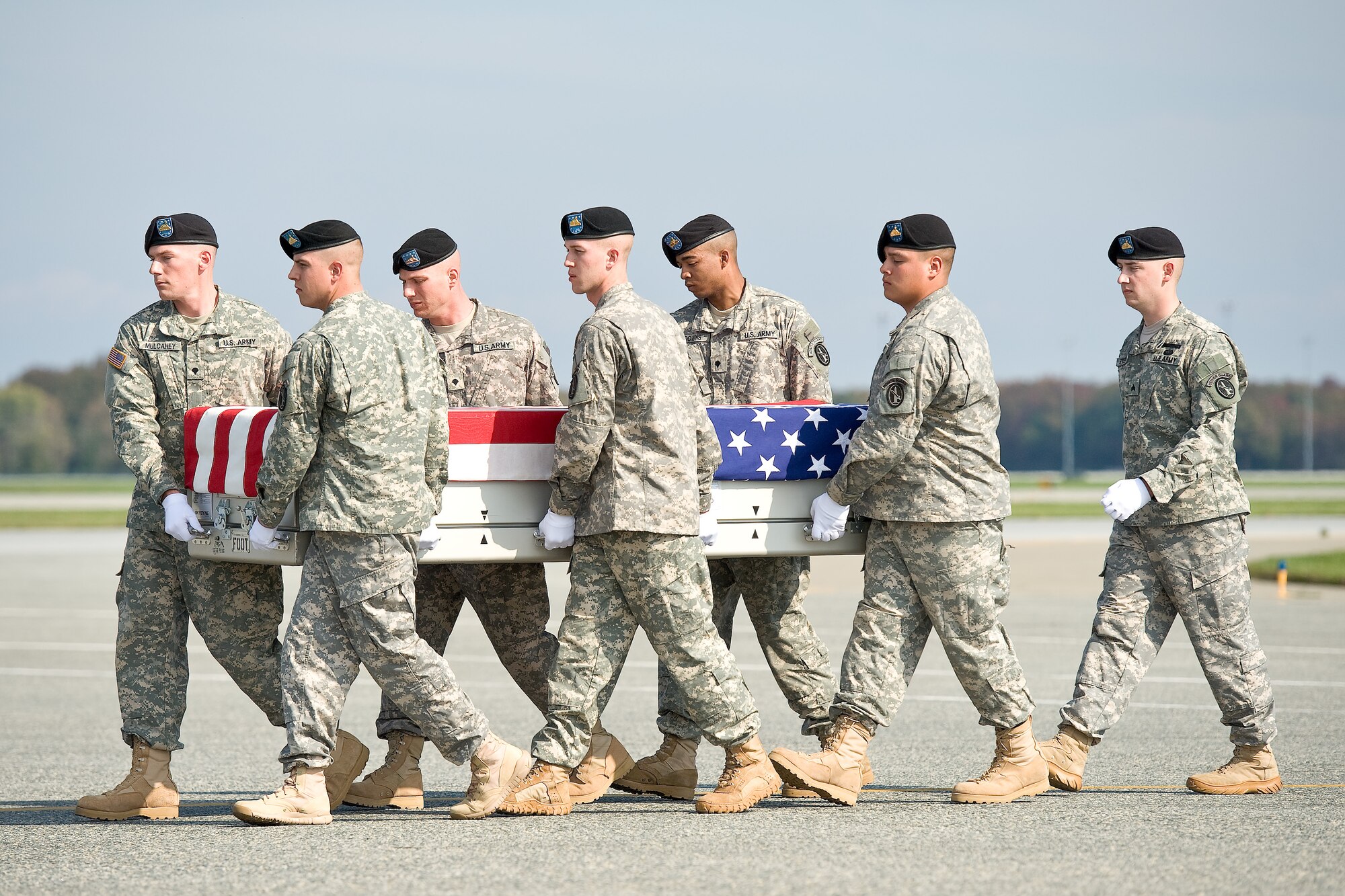 A U.S. Army carry team transfers the remains of Army Sgt.Paul A. Rivera, of Round Rock, Texas, at Dover Air Force Base, Del., Oct. 24, 2011. Rivera was assigned to the 709th Military Police Battalion, 18th Military Police Brigade, 21st Theater Sustainment Command, Hohenfels, Germany. (U.S. Air Force photo/Roland Balik)