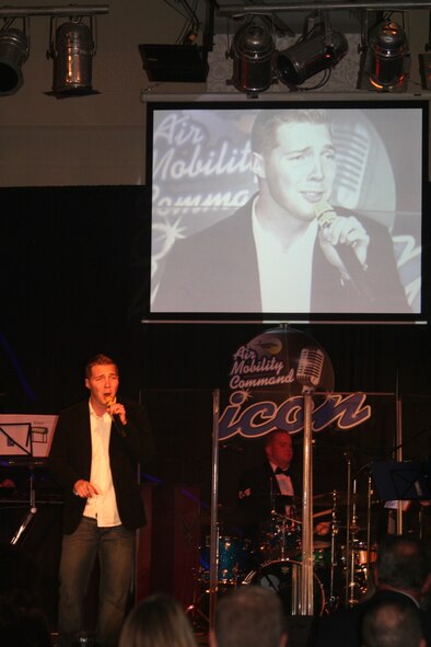 Airman 1st Class Tim Sentz sings "Why Don't We Just Dance" during the Air Mobility Command Icon finals competition Oct. 20, 2011, at Scott Air Force Base, Ill. Sentz made it to the finals by winning the base level competition at Scott AFB. Icon is an AMC commander's initiative to showcase the vocal talents of AMC Airmen. Each AMC base holds Icon contests in July and August to determine their representatives for the command final which takes place at Scott AFB. (U.S. Air Force Photo/Master Sgt. Scott T. Sturkol)