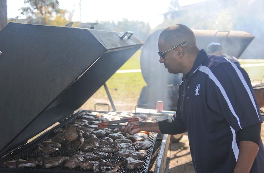 U.S Air Force Senior Master Sgt. Gerald Richard, 23rd Equipment Maintenance Squadron first sergeant, prepares steaks during a first sergeants cookout at Moody Air Force Base, Ga., Oct. 21, 2011. Richard was part of a team of first sergeants who came together and cooked for members of the Moody community. (U.S. Air Force photo by Airman 1st Class Paul Francis/Released)




