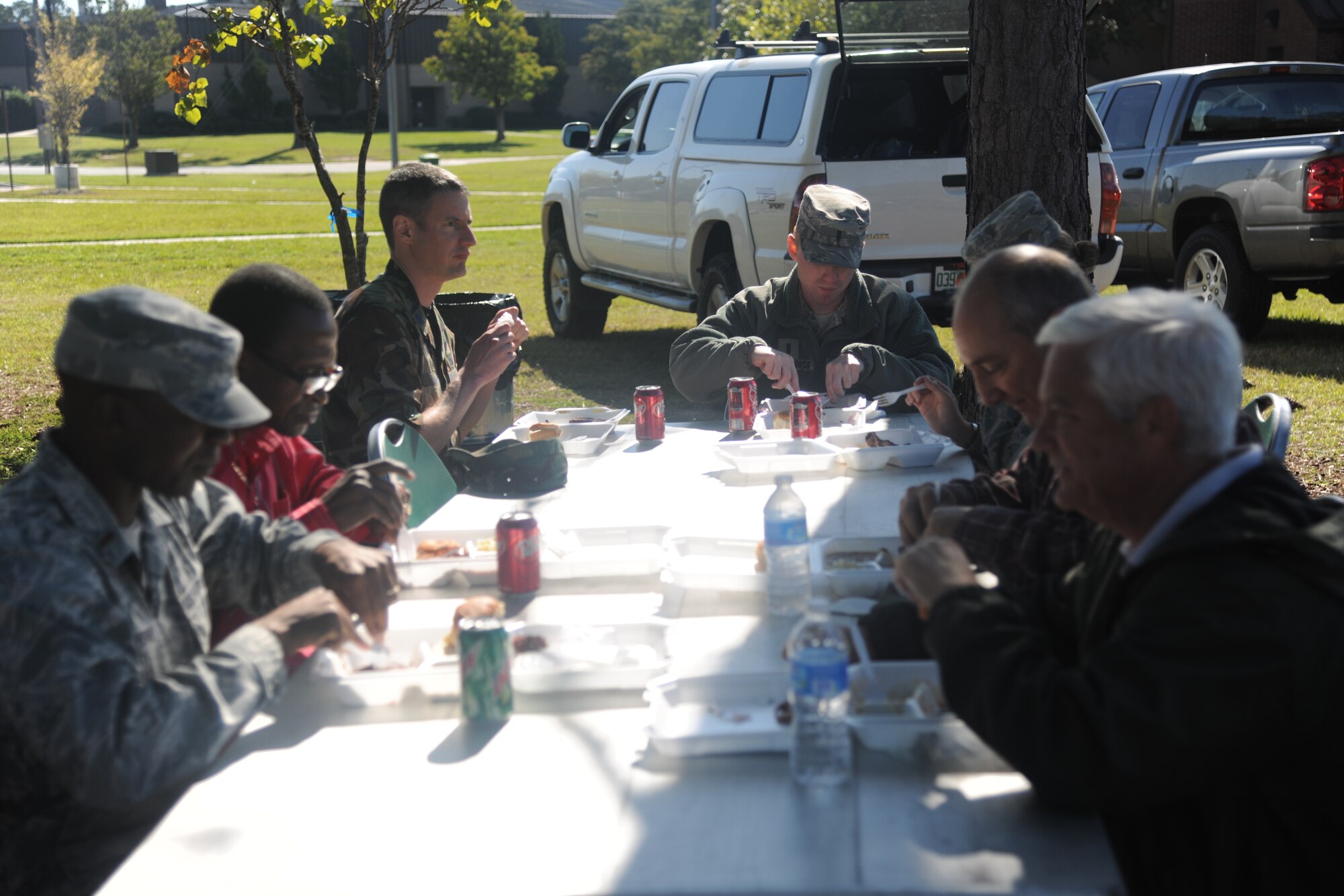 Members of the Moody Air Force Base, Ga., community eat their meals outside of the Georgia Pines Dining Facility during the first sergeants cookout Oct. 21, 2011. The cookout was hosted by Moody first sergeants and was open for all Team Moody members to take part in. (U.S. Air Force photo by Airman 1st Class Paul Francis/Released) 


