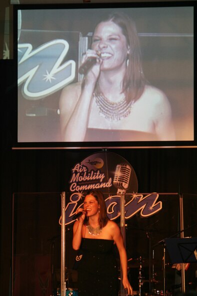 Capt. Manuela Peters sings "Defying Gravity" during the Air Mobility Command Icon finals competition Oct. 20, 2011, at Scott Air Force Base, Ill. Peters made it to the finals by winning the base level competition at Fairchild AFB and she earned second place in the finals. Icon is an AMC commander's initiative to showcase the vocal talents of AMC Airmen. Each AMC base holds Icon contests in July and August to determine their representatives for the command final which takes place at Scott AFB. (U.S. Air Force Photo/Master Sgt. Scott T. Sturkol)