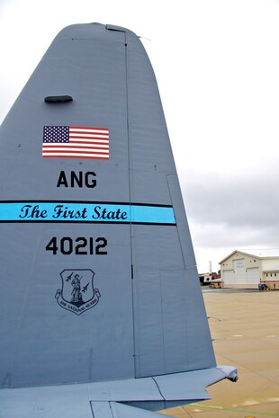 C-130H aircraft with The First State tail number 40212 from the 166th Airlift Wing on the Delaware Air National Guard ramp with the maintenance hangar in the background at the New Castle ANG Base, Del. on Sept. 22, 2011. (U.S. Air Force photo/Tech. Sgt. Lionel Castellano)