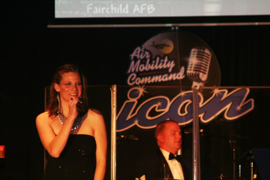 Capt. Manuela Peters sings "Defying Gravity" during the Air Mobility Command Icon finals competition Oct. 20, 2011, at Scott Air Force Base, Ill. Peters made it to the finals by winning the base level competition at Fairchild AFB and she earned second place in the finals. Icon is an AMC commander's initiative to showcase the vocal talents of AMC Airmen. Each AMC base holds Icon contests in July and August to determine their representatives for the command final which takes place at Scott AFB. (U.S. Air Force Photo/Master Sgt. Scott T. Sturkol)
