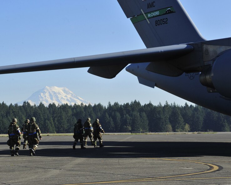 Airmen wearing mission oriented protective posture gear prepare to conduct a simulated post-attack reconnaissance sweep during a mobility exercise Oct. 18, 2011, at Joint Base Lewis-McChord, Wash. (U.S. Air Force photo/Staff Sgt. Frances Kriss)