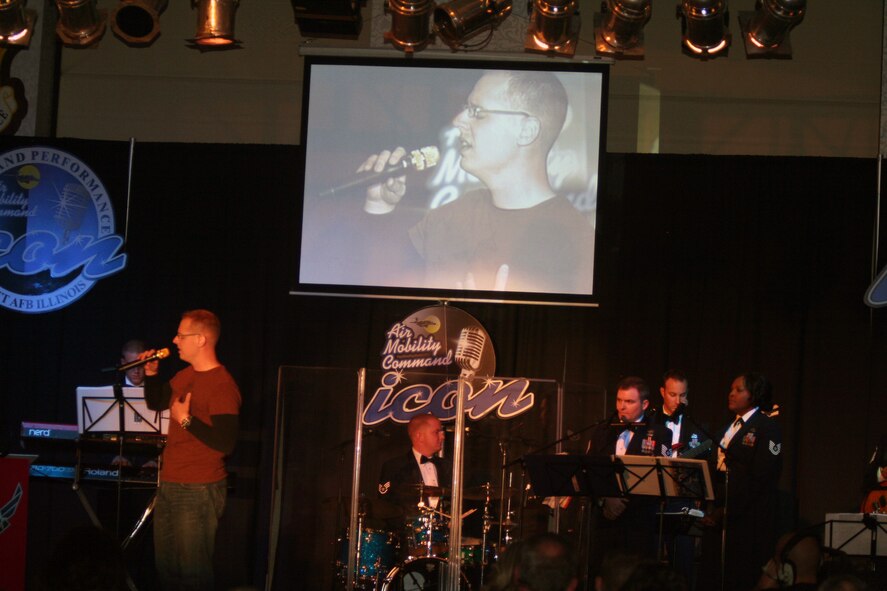 First Lt. Jonathan Lanning sings "Desperado" during the Air Mobility Command Icon finals competition Oct. 20, 2011, at Scott Air Force Base, Ill. Lanning made it to the finals by winning the base level competition at McConnell AFB. Icon is an AMC commander's initiative to showcase the vocal talents of AMC Airmen. Each AMC base holds Icon contests in July and August to determine their representatives for the command final which takes place at Scott AFB. (U.S. Air Force Photo/Master Sgt. Scott T. Sturkol)