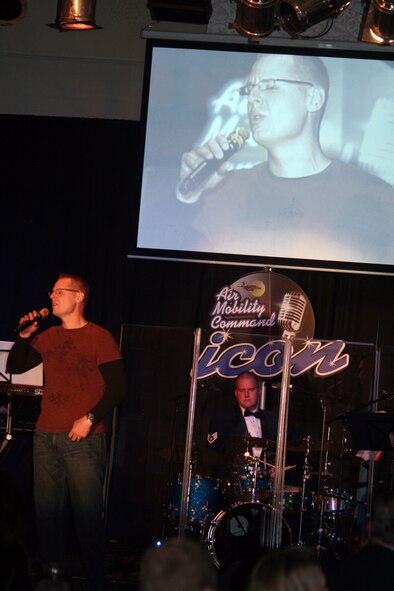 First Lt. Jonathan Lanning sings "Desperado" during the Air Mobility Command Icon finals competition Oct. 20, 2011, at Scott Air Force Base, Ill. Lanning made it to the finals by winning the base level competition at McConnell AFB. Icon is an AMC commander's initiative to showcase the vocal talents of AMC Airmen. Each AMC base holds Icon contests in July and August to determine their representatives for the command final which takes place at Scott AFB. (U.S. Air Force Photo/Master Sgt. Scott T. Sturkol)