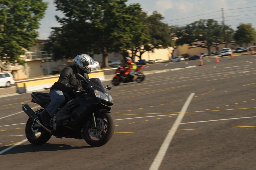 Miguel Capellan, Air Force Global Strike Command, practices turns during a military sport bike rider course on Barksdale Air Force Base, La., Oct. 22. According to the Barksdale motorcycle safety policy letter, new military motorcycle riders assigned to Barksdale are not authorized to operate a motorcycle at any time while on public roads or on base until an approved motorcycle safety course has been completed, with the exception of traveling to a course. Personnel who own a sport bike are required to take the eight-hour military sport bike rider course or the advance rider course. (U.S. Air Force photo/Senior Airman Kristin High)(RELEASED)