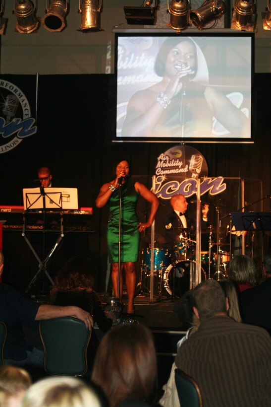 Tech. Sgt. Chastity Sullivan sings "I Believe in You and Me" during the Air Mobility Command Icon finals competition Oct. 20, 2011, at Scott Air Force Base, Ill. Sullivan, from the Joint Communications Support Element at MacDill Air Force Base, Fla., was participating in her first Icon competition. The Valdosta, Ga., native made it to the finals by winning the base level competition at MacDill AFB. Icon is an AMC commander's initiative to showcase the vocal talents of AMC Airmen. Each AMC base holds Icon contests in July and August to determine their representatives for the command final which takes place at Scott AFB. (U.S. Air Force Photo/Master Sgt. Scott T. Sturkol)
