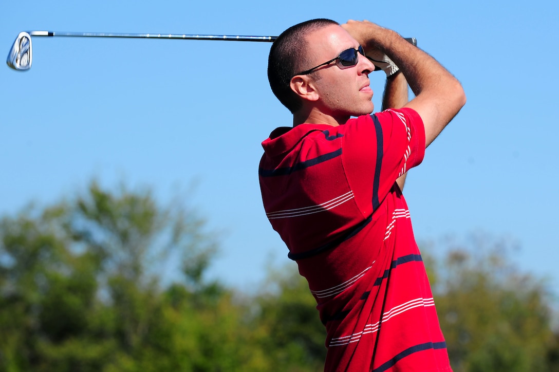U.S. Air Force Staff Sgt. Richard Riddle, 633rd Air Base Wing Communications Squadron cyber transport supervisor, takes part in the Langley Chief's Group "Chief Mik" Golf Tournament at Langley Air Force Base, Va., Oct. 21, 2011.  Approximately 100 golfers participated in the event at Langley’s Eaglewood Golf Course.  (U.S. Air Force photo by Airman 1st Class Kayla Newman/Released)

