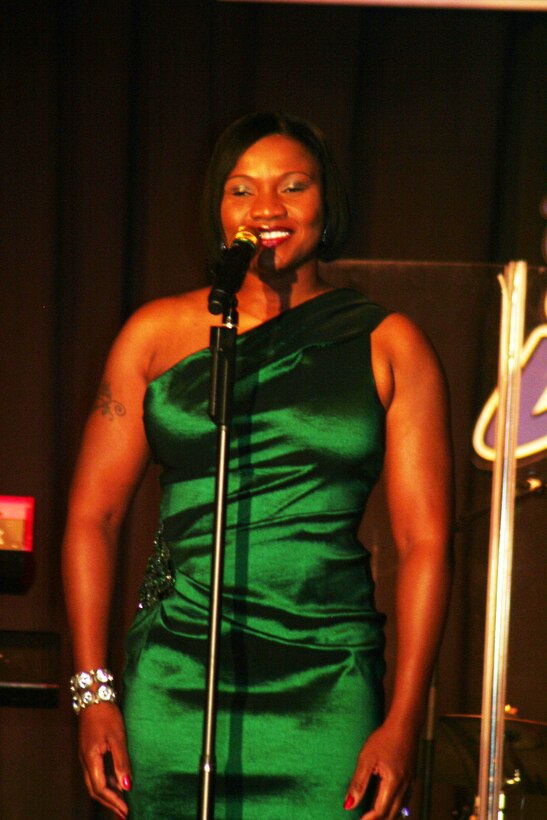 Tech. Sgt. Chastity Sullivan sings "I Believe in You and Me" during the Air Mobility Command Icon finals competition Oct. 20, 2011, at Scott Air Force Base, Ill. Sullivan, from the Joint Communications Support Element at MacDill Air Force Base, Fla., was participating in her first Icon competition. The Valdosta, Ga., native made it to the finals by winning the base level competition at MacDill AFB. Icon is an AMC commander's initiative to showcase the vocal talents of AMC Airmen. Each AMC base holds Icon contests in July and August to determine their representatives for the command final which takes place at Scott AFB. (U.S. Air Force Photo/Master Sgt. Scott T. Sturkol)