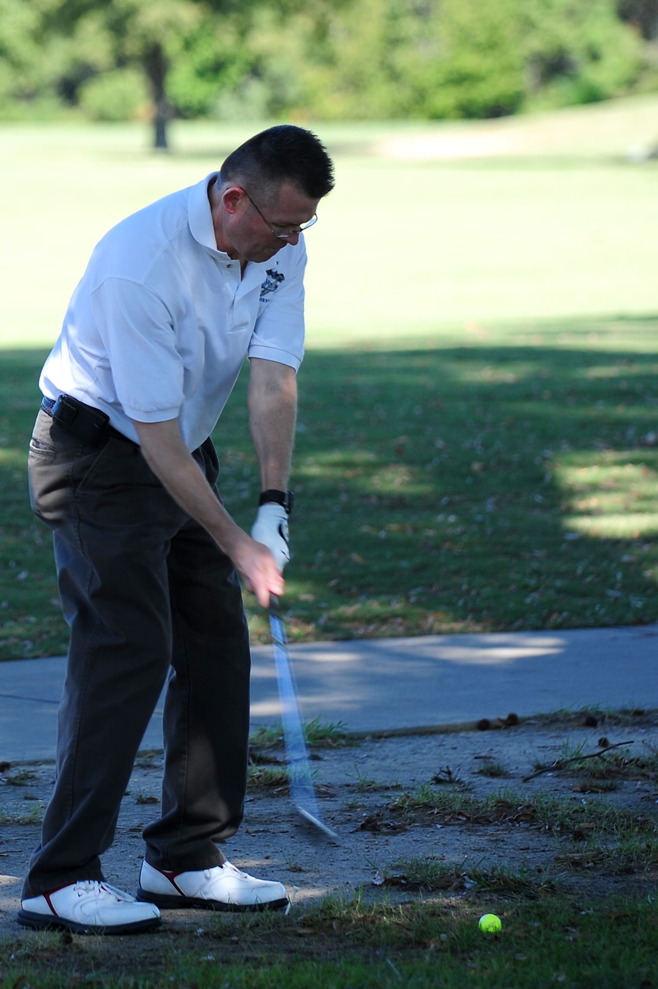 U.S. Air Force Chief Master Sgt. Kevin Howell, 633rd Air Base Wing command chief, participates in the second Langley Chief's Group "Chief Mik" Golf Tournament at Langley Air Force Base, Va., Oct. 21, 2011.  The tournament is held annually in honor of the late Chief Master Sgt. Denise "Mik" Mikolajczyk.  (U.S. Air Force photo by Airman 1st Class Kayla Newman/Released)