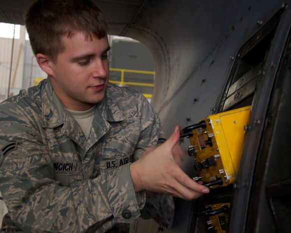 Airman 1st Class Steven Hroncich, an electronic warfare technician in the 166th Maintenance Squadron, 166th Airlift Wing, Del. Air National Guard, is inspecting a component from a C130H Hercules on Sept. 20, 2011 in the main hangar at the New Castle ANG Base, Del. Unit members routinely inspect the aircraft to insure serviceability and readiness. (U.S. Air Force Photo/Tech. Sgt. Lionel Castellano)