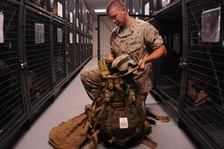 Sergeant James Brantley packs essential gear he will need for an upcoming field exercise. Brantley is a Reservist assigned to the Marine Corps Reserve Training Command, 4th Landing Support Battalion, Charlie Company at Joint Base Charleston - Weapons Station and is preparing for a year-long deployment. (U.S. Navy photo/Petty Officer 1st Class Jennifer Hudson)