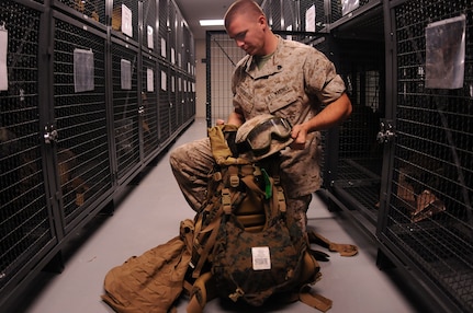 Sergeant James Brantley packs essential gear he will need for an upcoming field exercise. Brantley is a Reservist assigned to the Marine Corps Reserve Training Command, 4th Landing Support Battalion, Charlie Company at Joint Base Charleston - Weapons Station and is preparing for a year-long deployment. (U.S. Navy photo/Petty Officer 1st Class Jennifer Hudson)