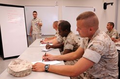Staff Sgt. Jonathan Flum facilitates a course on convoy operations to help prepare seven Reservists for an upcoming overseas deployment. The Marines come from the southeastern United States and volunteered for the year-long deployment. Flum is an instructor at the Marine Corps Reserve Training Command, 4th Landing Support Battalion, Charlie Company at Joint Base Charleston - Weapons Station. (U.S. Navy photo/Petty Officer 1st Class Jennifer Hudson)