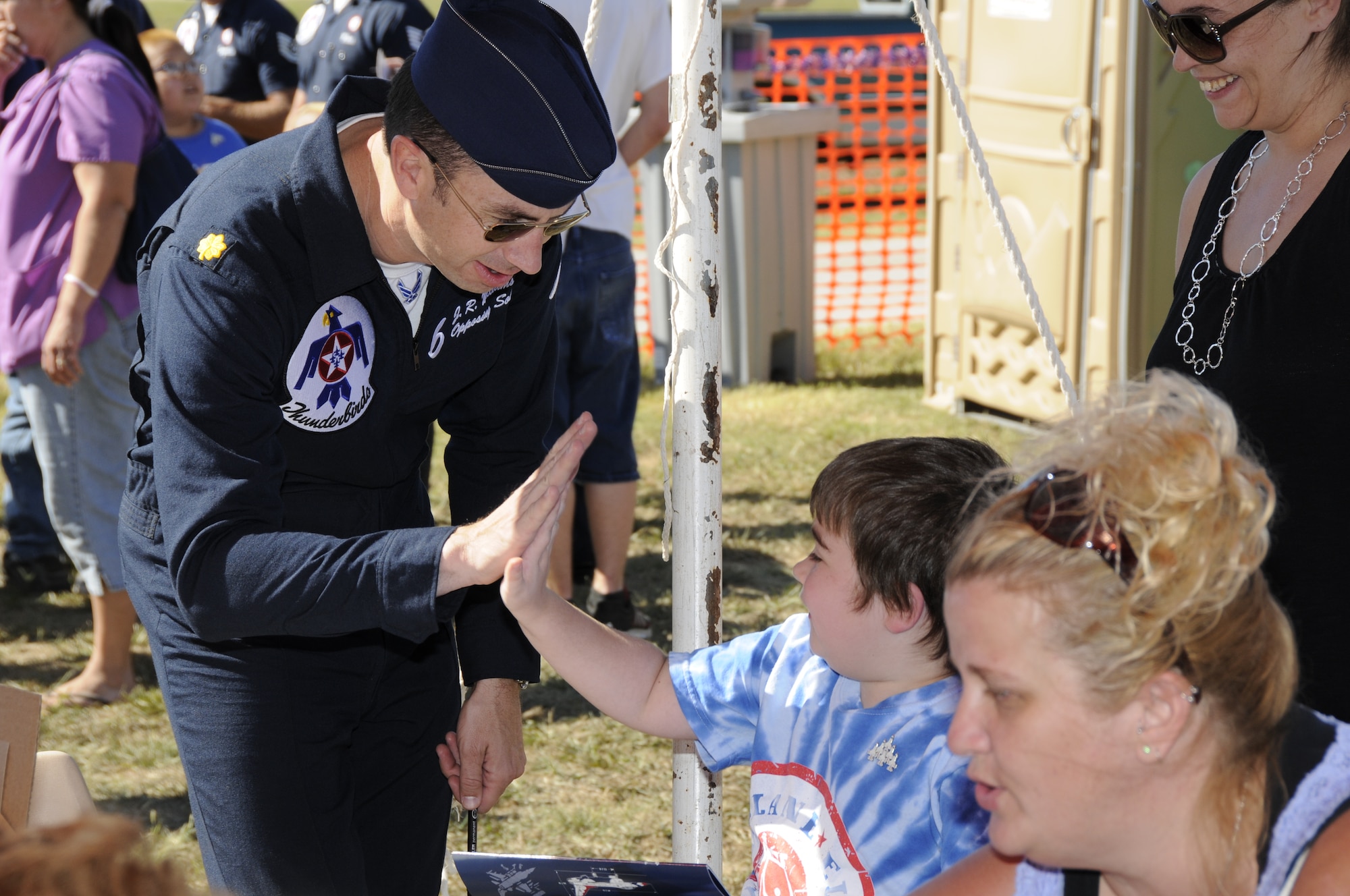 Maj. J.R. Williams, U.S. Air Force Air Demonstration Squadron pilot, meets with children from Make-A-Wish following the Thunderbirds’ performance at the Fort Smith Air Show Sept. 30. (U.S. Air Force photo by Airman 1st Class John Hillier/188th Fighter Wing Public Affairs) 