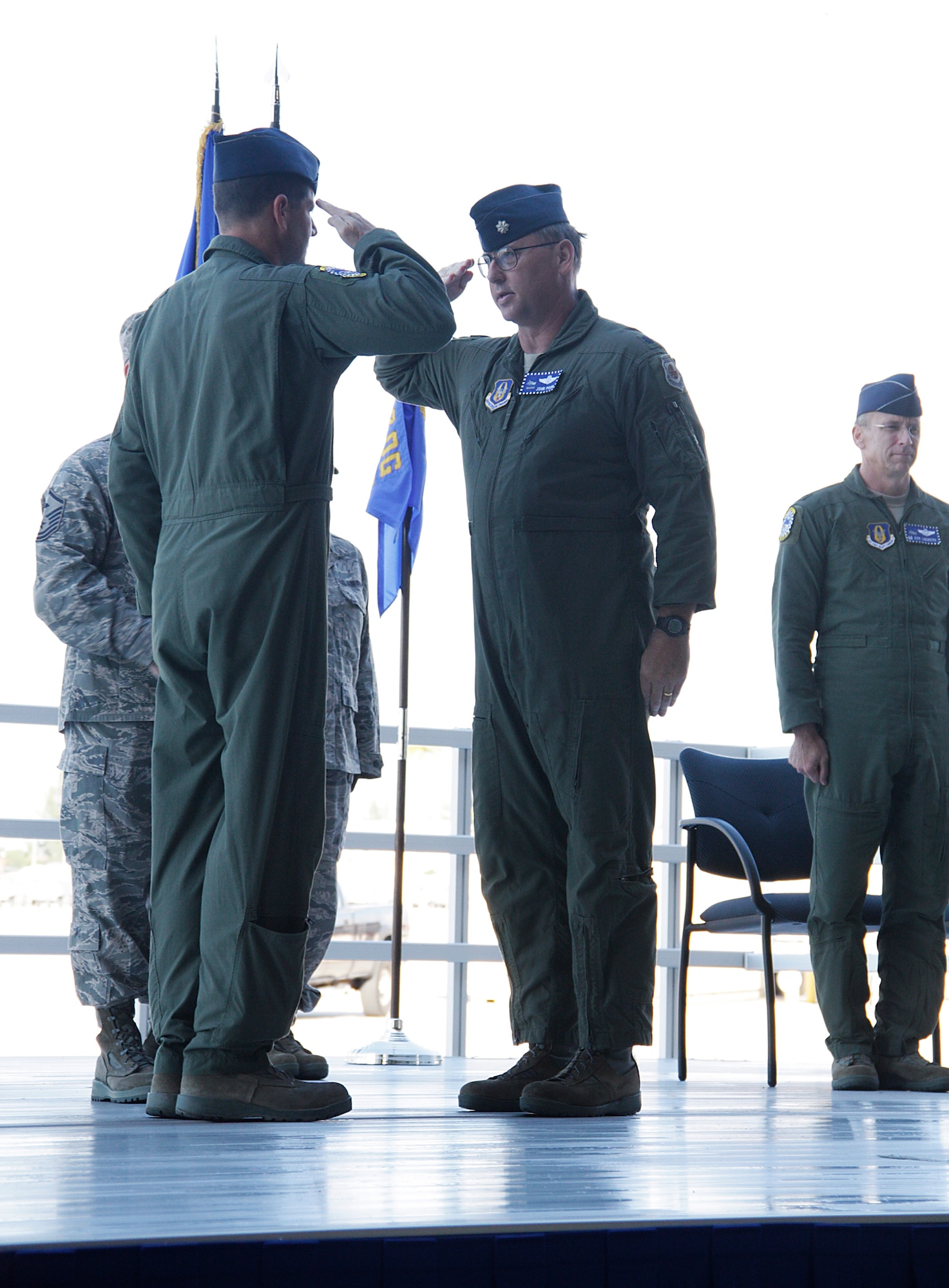 Lt. Col. Michael F. Hernandez, left, Commander, 482nd Operations Group passes the guidon to Lt. Col. John G. Poor, as he assumed command of the 482nd Operations Support Squadron. (U.S. Air Force photo/Senior Airman Jacob Jimenez)