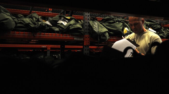 Technical Sgt. Robert Hall checks his inventory while preparing Chemical-bags for the Operational Readiness Exercise at Joint Base Charleston Air Base Oct. 20. Hall, along with other Airmen, pre-built the C-bags for deploying Airmen participating in the Operation Readiness Exercise. The exercise is scheduled from Oct. 22  to Oct. 29. and go through Oct.29. A C-bag is issued to deploying Airmen  if there is a chemical-biological threat in the deployment area and contains two complete ground crew ensembles, M8/M9 paper and decontamination kits. Hall is from the 628th Logistics Readiness Squadron. (U.S. Air Force photo/Airman 1st Class Ashlee Galloway)