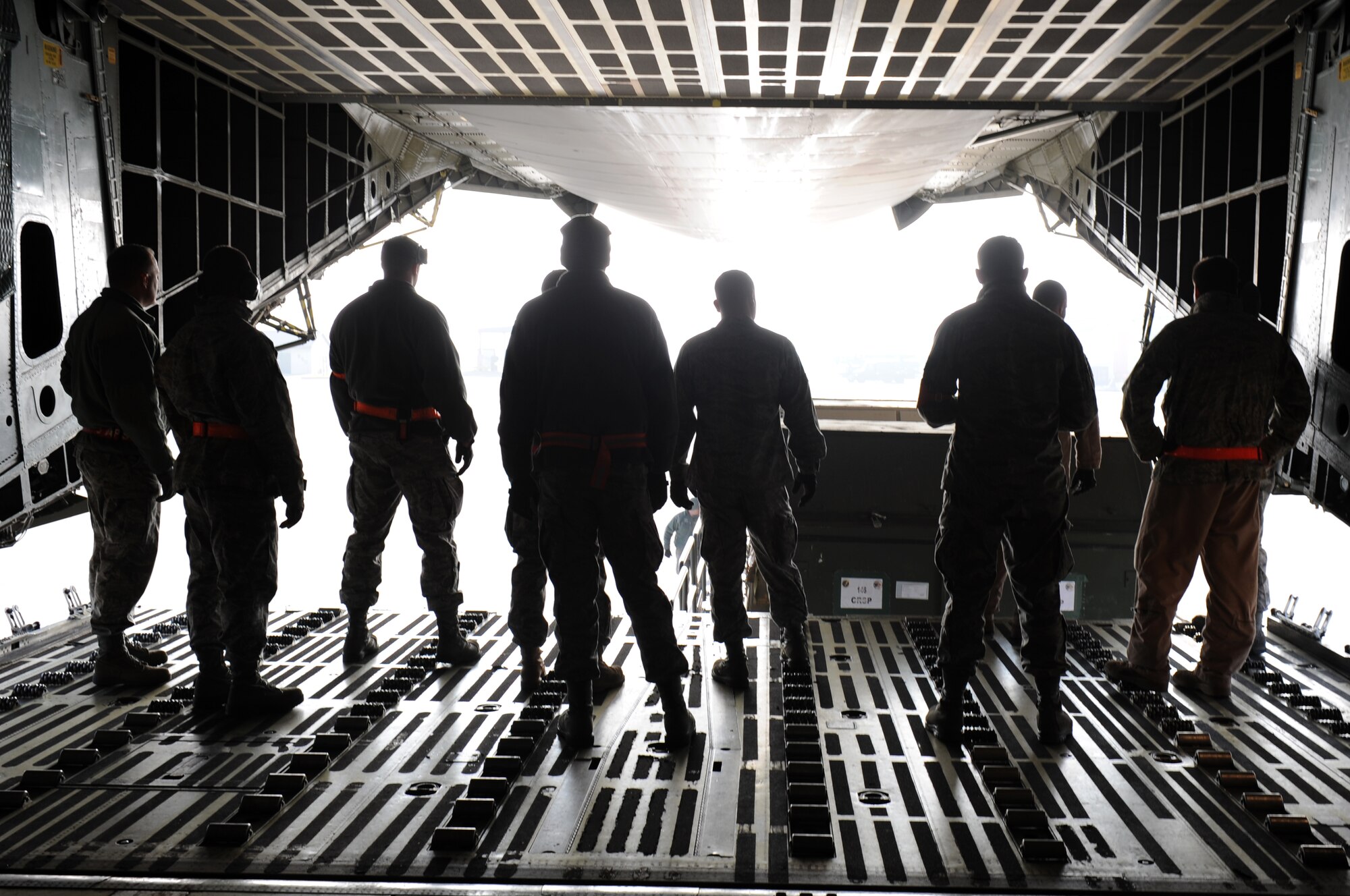SPANGDAHLEM AIR BASE, Germany -- Airmen from the 52nd Logistics Readiness Squadron, the 726th Air Mobility Squadron and Dover Air Force Base, Del., unload cargo from a C-5 Galaxy Oct. 24 on ramp 5. The cargo belongs to the 480th Fighter Squadron here who recently returned from a deployment to Iraq in support of Operation New Dawn. (U.S. Air Force photo/Airman 1st Class Brittney Frees)