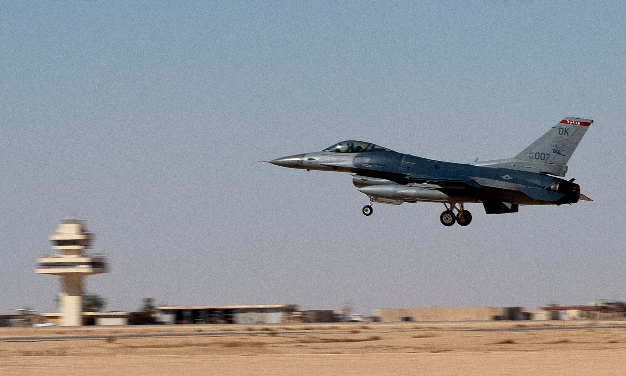 An F-16 Fighting Falcon from the 125th Expeditionary Fighter Squadron lands in Iraq Oct. 1, 2011. The squadron deployed in support of Operation New Dawn and will provide close air support for more than 40,000 troops leaving Iraq by the end of the year. The 125th EFS is comprised of F-16s, pilots, maintenance specialists and support personnel from the Oklahoma Air National Guard’s 138th Fighter Wing in Tulsa, Okla. The squadron also includes members from the Ohio Air National Guard’s 180th Fighter Wing in Toledo, Ohio, and the Arizona Air National Guard’s 162nd Fighter Wing in Tucson, Ariz. (U.S. Air Force photo/Master Sgt. Cecilio Ricardo)