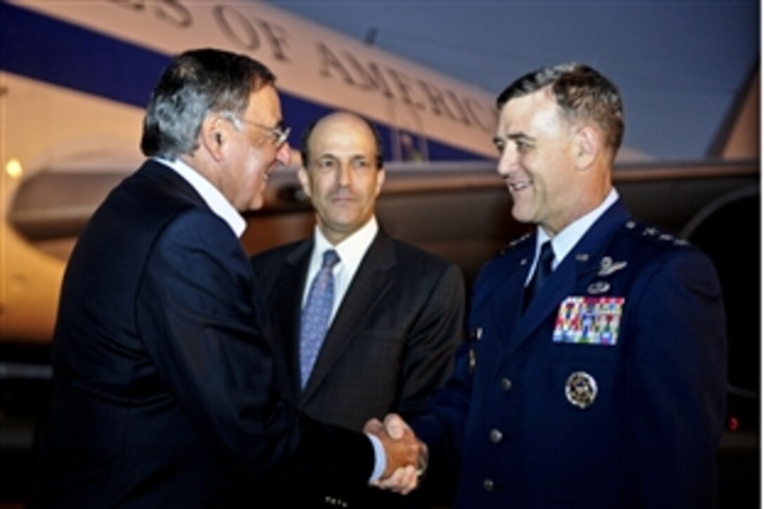 U.S. Air Force Lt. Gen. Burton Field, commander of U.S. Forces Japan, greets U.S. Defense Secretary Leon E. Panetta on Yokota Air Base, Japan, Oct. 24, 2011. 