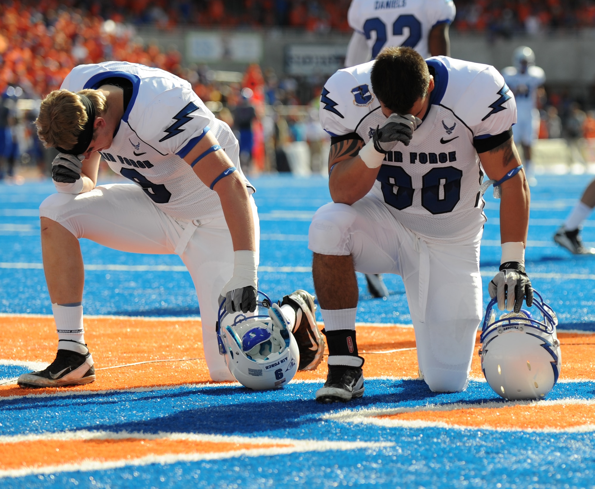 Two Air Force Academy Falcons exercise one of the freedoms they have sworn to defend prior to their game against the Boise State University Broncos Oct. 22, 2011. The Falcons were 30-point underdogs going into the game at Broncos Stadium in Boise, Idaho, but managed to hold BSU to an 11-point lead at the end of the game. (U.S. Air Force photo by 2nd Lt. David Liapis)