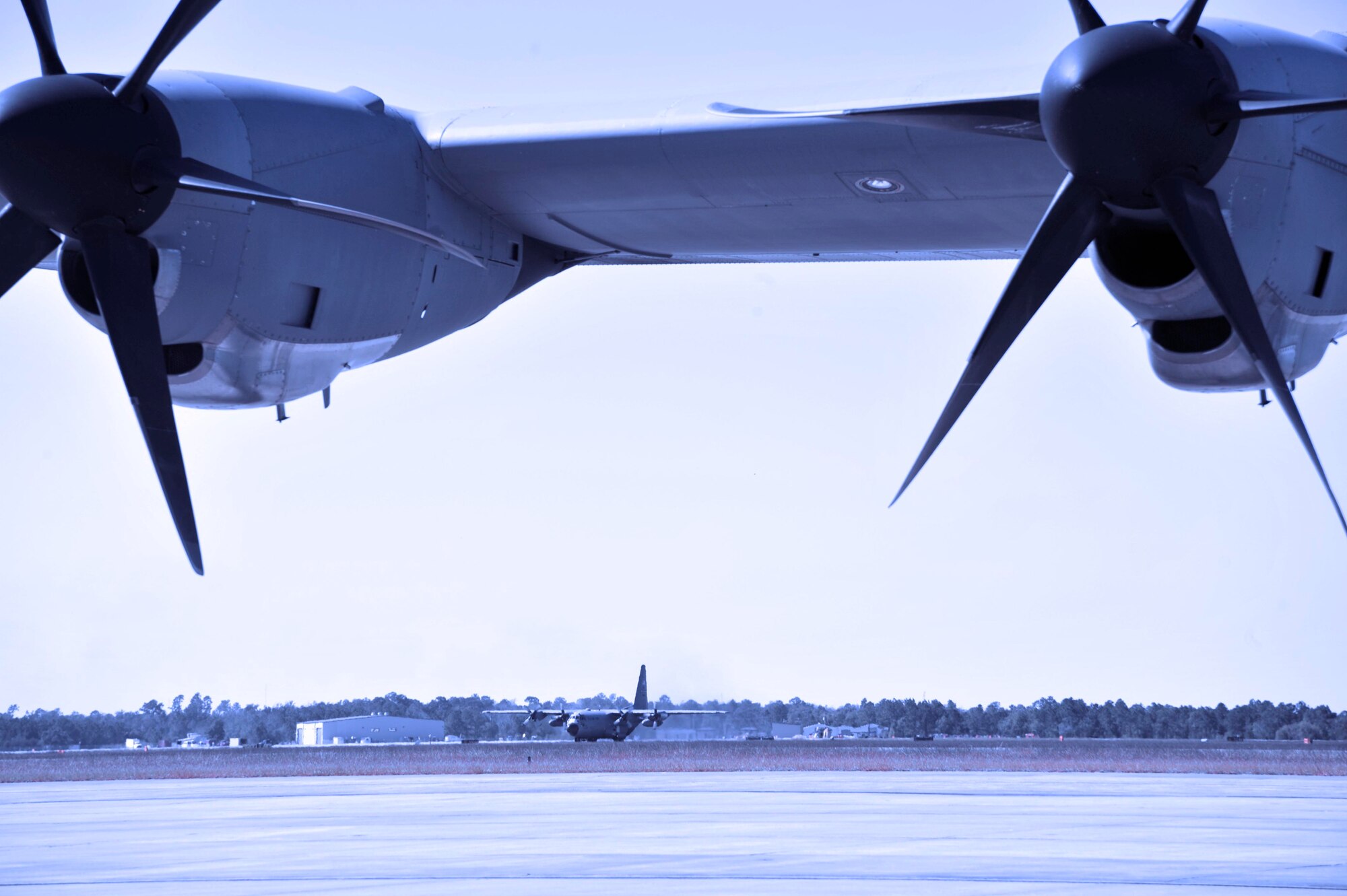 An 815th Airlift Squadron C-130J lands at the Combined Readiness Training Center, Gulfport, Miss. Oct. 21. The aircraft returned to the CRTC to transport 403rd Wing Reservists and cargo back to Keesler AFB at the conclusion of the three-wing Operational Readiness Exercise. The 403rd Wing, along with the 433rd Airlift Wing and 165th AW, participated in the five-day exercise that tested airmen on various military scenarios. The ORE is the precursor to the Wings' Operational Readiness Inspection in early 2012. (U.S. Air Force photo illustration by Maj. Heather Newcomb) 