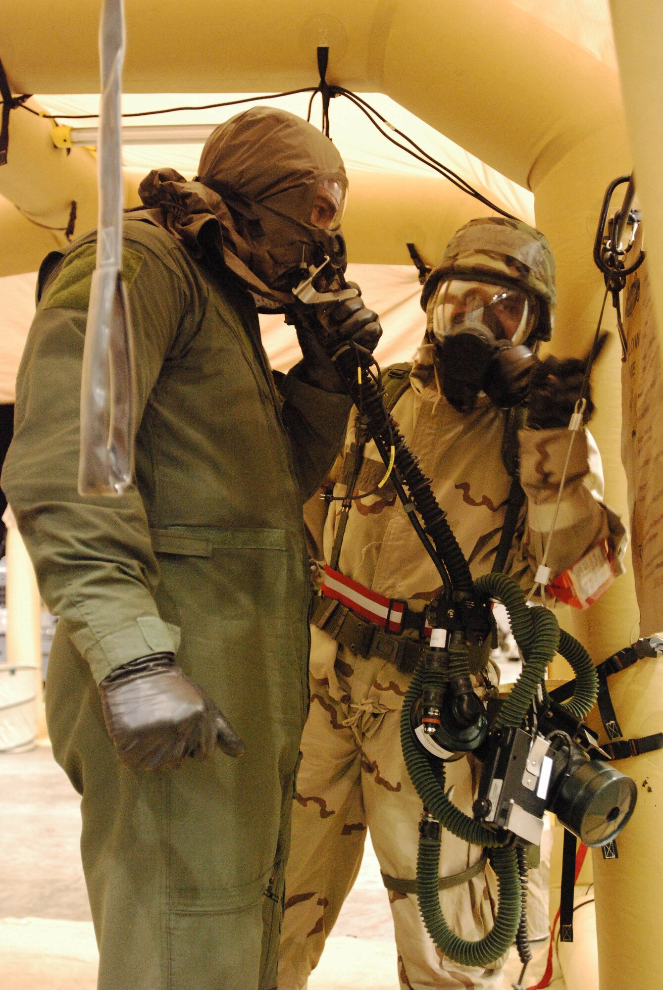 An aircrew member processes through the Contamination Control Area as part of a three-wing Operational Readiness Exercise Oct. 18 held at the Combined Readiness Training Center, Gulfport, Miss. The 403rd Wing, along with the 433rd Airlift Wing and 165th AW, participated in the five-day exercise that tested airmen on various military scenarios. The ORE is the precursor to the Wings' Operational Readiness Inspection in early 2012. (U.S. Air Force photo by Senior Airman Brian McGloin)