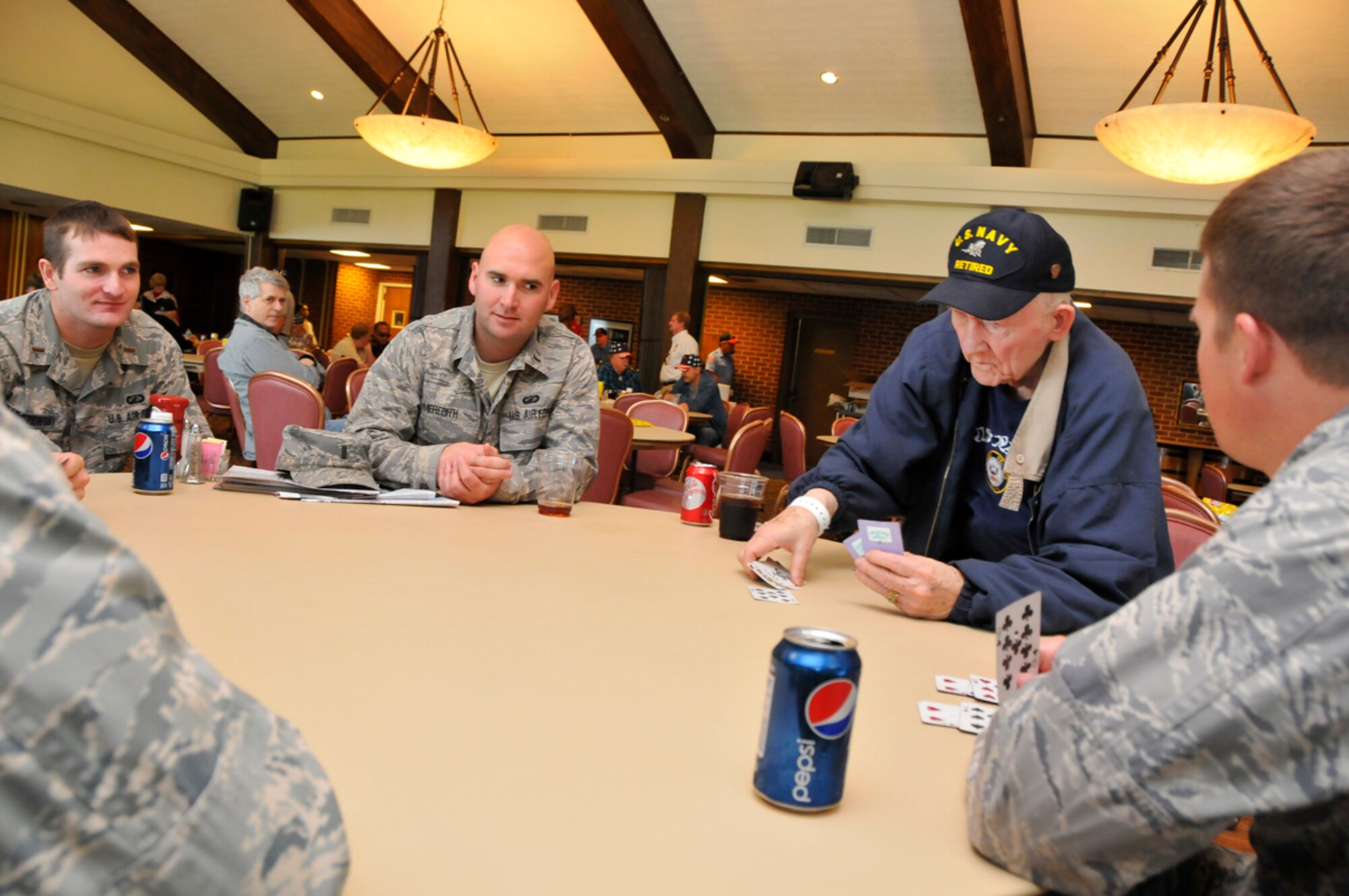 Veterans and Air Force personnel enjoy a “friendly” game of cards during the annual VA Picnic Oct. 6 at the ALC. (Photo by Rick Goodfriend)